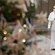 This handout photo taken on December 25, 2020, and released by the Vatican press office, the Vatican Media, shows Pope Francis arriving in the Vatican Blessing hall with a face mask prior to delivering his live-streamed Urbi et Orbi blessing. (Photo by Handout / VATICAN MEDIA / AFP) / RESTRICTED TO EDITORIAL USE - MANDATORY CREDIT "AFP PHOTO / VATICAN MEDIA" - NO MARKETING - NO ADVERTISING CAMPAIGNS - DISTRIBUTED AS A SERVICE TO CLIENTS