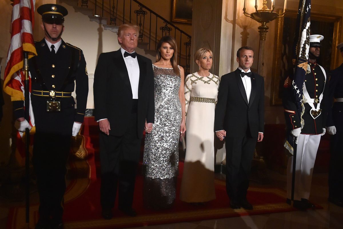 US President Donald Trump and First Lady Melania Trump arrive with French President Emmanuel Macron and his wife, Brigitte Macron, for a State Dinner Photo: AFP