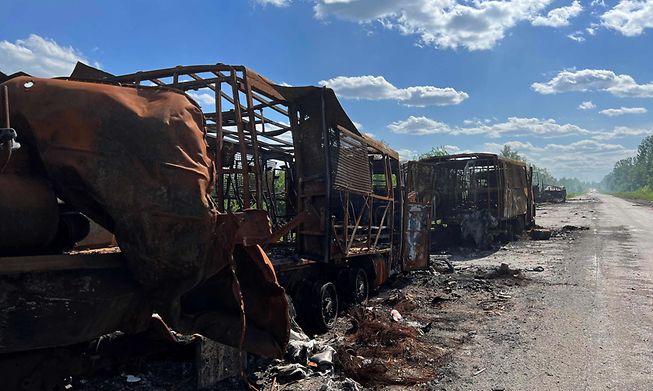 This photograph taken on 27 May 2022, shows Russian military vehicles destroyed on a road near the village of Kutuzivka,  Kharkiv region, amid the Russian invasion of Ukraine