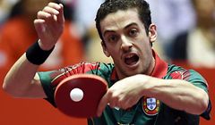 Marcos Freitas of Portugal returns the ball towards Koki Niwa of Japan during their men's singles quarter-final match of the 2014 World Team Table Tennis Championships in Tokyo on May 2, 2014.     AFP PHOTO/Toshifumi KITAMURA
