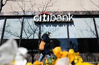 A woman walks past a Citibank branch in Washington, DC, on March 14, 2023. - Wall Street stocks advanced early Tuesday, driven by a bounce in beaten down regional bank shares and a mixed inflation report. (Photo by ANDREW CABALLERO-REYNOLDS / AFP)