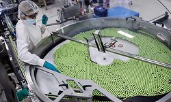 An employee is at work on the vaccine packing line of the factory of British  pharmaceutical company GlaxoSmithKline (GSK) in Wavre on February 8, 2021 where the Covid-19 CureVac vaccine will be produced. - British pharmaceutical group GlaxoSmithKline (GSK) and German biotech firm CureVac announced plans to jointly develop a coronavirus vaccine with the potential to counter multi-variants of Covid-19. (Photo by Kenzo TRIBOUILLARD / AFP)