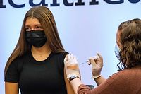 Children 12-15 years old receive a Pfizer-BioNTech Covid-19 vaccine booster at Hartford Hospital in Hartford, Connecticut on January 6, 2022. (Photo by Joseph Prezioso / AFP)