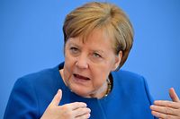 German Chancellor Angela Merkel gives a press conference on March 11, 2020 in Berlin to comment on the situation of the spread of the novel coronavirus in the country. (Photo by Tobias SCHWARZ / AFP)