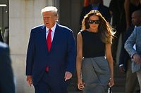 TOPSHOT - Former US President Donald Trump and his wife,  Melania Trump, leave a polling station after voting in the US midterm elections in Palm Beach, Florida, on November 8, 2022. (Photo by Eva Marie UZCATEGUI / AFP)