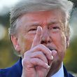 (FILES) In this file photo taken on October 11, 2019 US President Donald Trump speaks to the press after announcing and initial deal with China on the South Lawn of the White House in Washington, DC. - US President Donald Trump warned October 14, 2019 that Turkey faces imminent sanctions over its incursion into northeastern Syria against Kurdish militia, but also signalled that Washington would avoid armed conflict with Ankara."Big sanctions on Turkey coming!" Trump said, after Turkish attacks stepped up over the weekend on the Syrian Kurds, who had allied with the US war against the Islamic State group. (Photo by Nicholas Kamm / AFP)