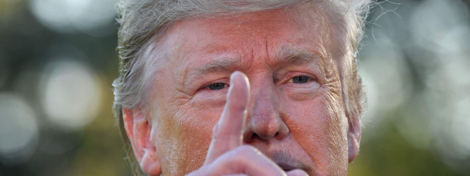 (FILES) In this file photo taken on October 11, 2019 US President Donald Trump speaks to the press after announcing and initial deal with China on the South Lawn of the White House in Washington, DC. - US President Donald Trump warned October 14, 2019 that Turkey faces imminent sanctions over its incursion into northeastern Syria against Kurdish militia, but also signalled that Washington would avoid armed conflict with Ankara."Big sanctions on Turkey coming!" Trump said, after Turkish attacks stepped up over the weekend on the Syrian Kurds, who had allied with the US war against the Islamic State group. (Photo by Nicholas Kamm / AFP)