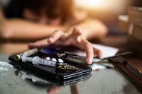 Drug addicted woman getting heroin injection in the room,Drug abuse, substance abuse