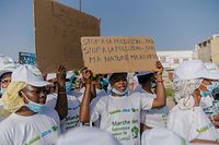 Women take part in a march for the environment in Dakar on October 23, 2021, one week before the COP26 global climate summit. (Photo by CARMEN ABD ALI / AFP)