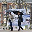 Britain's Prince William, Duke of Cambridge and Britain's Prince Harry walk away after looking at tributes left by members of the public at one of the entrances of Kensington Palace to mark the coming 20th anniversary of the death of Diana, Princess of Wales, in London on August 30, 2017.
Princes William and Harry prepared to pay tribute to their late mother Princess Diana on Wednesday for the 20th anniversary of her death as wellwishers left candles and flowers outside the gates of her former London residence. The Princes visited the Sunken Garden in the grounds of Kensington Palace, which this year has been transformed into a White Garden, dedicated to their late mother, Britain's Diana, Princess of Wales. / AFP PHOTO / POOL / Kirsty Wigglesworth