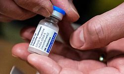 A picture taken on April 12, 2021 shows a phial of Johnson & Johnson Janssen Covid-19 vaccine as the first doses proceeding from the Dutch city of Leiden are stored at the Movianto distribution center in Oss. - Johnson & Johnson Janssen Covid-19 vaccine is the fourth corona vaccine that will become available in the Netherlands. (Photo by ROB ENGELAAR / ANP / AFP) / Netherlands OUT