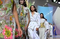 Models present creations for Elie Saab during the Spring-Summer 2023 fashion show as part of the Paris Womenswear Fashion Week, in Paris, on October 1, 2022. (Photo by Emmanuel DUNAND / AFP)
