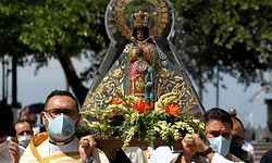 The image of the Virgin of Zapopan, also known as the "Queen of Lake Chapala," is taken through the streets during its summer visit to the lakeside in Chapala, state of Jalisco, Mexico, after the easing of measures and restrictions imposed to fight the spread of the novel coronavirus, COVID-19, on July 12, 2020. (Photo by ULISES RUIZ / AFP)