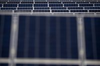 Solar panels are pictured at Lenham Solar Farm near Maidstone, south east England, on January 6, 2023. (Photo by Ben Stansall / AFP)