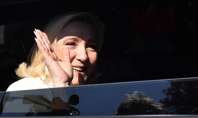 Far-right Rassemblement National party presidential candidate Marine Le Pen waves during a campaign visit in northwestern France on Friday