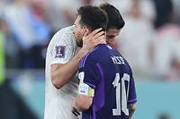 TOPSHOT - Poland's forward #09 Robert Lewandowski (L) and Argentina's forward #10 Lionel Messi greet each other at the end of the Qatar 2022 World Cup Group C football match between Poland and Argentina at Stadium 974 in Doha on November 30, 2022. (Photo by Giuseppe CACACE / AFP)