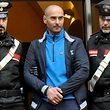 Calogero Lo Piccolo (C), the son of a powerful boss nicknamed "The Baron", leaves escorted the Carabinieri's headquarter on January 22, 2019, in Palermo, after his arrest. - Anti-mafia police said on January 22 they had dealt a fresh blow to Italy's Cosa Nostra, arresting seven suspected rising-star mobsters after two of the organised crime group turned state witnesses.The raids followed a major swoop against the resurgent Sicilian mafia in December when a jeweller was captured just before he was due to be officially anointed "boss of bosses" of the reconvened Mafia Commission or Cupola. (Photo by Alessandro FUCARINI / AFP)