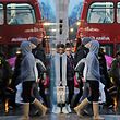 FILE PHOTO:  Shoppers are reflected in a shop window as they walk along Oxford Street in London, Britain, December 21, 2013.   REUTERS/Luke MacGregor/File Photo