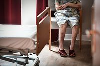(FILES)In this file photo taken on July 5, 2018 an elderly resident sits in her bedroom in an establishment of accommodation for dependent elderly (EHPAD) in Paris. - Orpea's chief executive Yves Le Masne has been dismissed from his position on January 30, 2022, the group announced in a statement. The group had been in turmoil since days after the revelations of a book evoking dysfunctions in private Ehpad. (Photo by STEPHANE DE SAKUTIN / AFP)