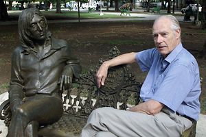 Former Beatles producer Sir George Martin visits a sculpture of John Lennon in a Havana park named after the musician, in this October 30, 2002 file photo. The legendary music producer who shaped the Beatles into the world's most important pop music force, has died, Ringo Starr said on Twitter. He was 90 years old. REUTERS/Rafael Perez/Files