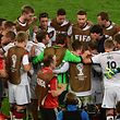 Germany's players gather ahead of extra time during the final football match between Germany and Argentina for the FIFA World Cup at The Maracana Stadium in Rio de Janeiro on July 13, 2014. AFP PHOTO / NELSON ALMEIDA