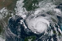 This National Oceanic and Atmospheric Administration(NOAA)/GOES satellite handout image shows Hurricane Ida at 14:16UTC, on August 28, 2021. - Residents evacuated high-risk areas and lined up to buy supplies on August 27 as Louisiana braced for Ida, expected to strengthen to an "extremely dangerous" Category 4 storm when it hits the southern US this weekend. The National Weather Service is now forecasting a "life-threatening storm surge" when the hurricane makes landfall along the coasts of Louisiana and Mississippi, warning of "catastrophic wind damage" and urging those in affected areas to follow advice from local officials. (Photo by Handout / NOAA/GOES / AFP) / RESTRICTED TO EDITORIAL USE - MANDATORY CREDIT "AFP PHOTO / NOAA/GOES" - NO MARKETING - NO ADVERTISING CAMPAIGNS - DISTRIBUTED AS A SERVICE TO CLIENTS