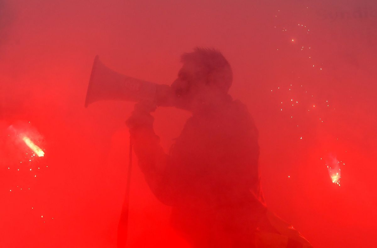 A demonstrator shouts slogans with a megaphone during a strike of SNCF railway workers over plans to overhaul the national state-owned railway company SNCF (photo: AFP)