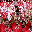 Benfica soccer players celebrate with the trophy after their victory against Maritimo in the end of the Portuguese League Cup final held at Cidade de Coimbra Stadium, Coimbra, Portugal, 29 May 2015.  JOSE COELHO/LUSA