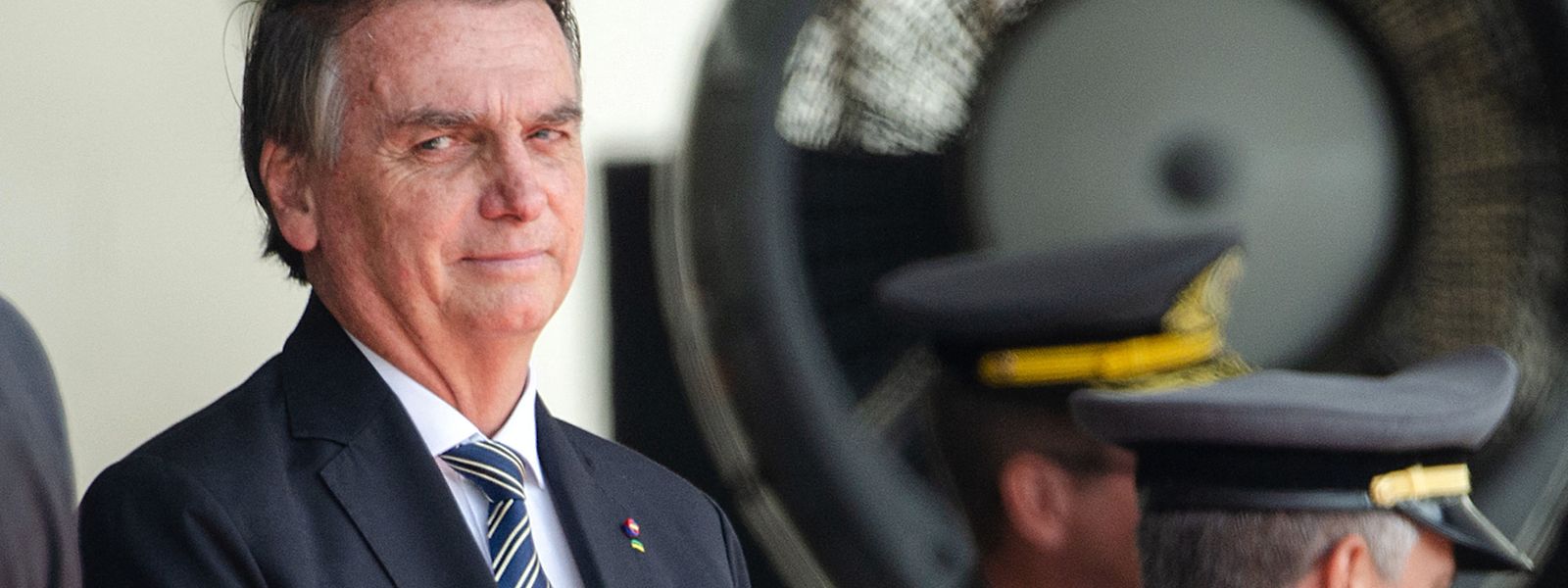 (FILES) In this file photo taken on November 26, 2022, Brazilian President Jair Bolsonaro gestures during a graduation ceremony for cadets at the Agulhas Negras Military Academy in Resende, Rio de Janeiro State, Brazil. - Brazil's outgoing president, Jair Bolsonaro, on December 23, 2022, pardoned security force agents convicted of crimes committed more than 30 years ago, which according to legal experts, applies to those responsible for the 1992 Carandiru prison massacre. (Photo by T�RCIO TEIXEIRA / AFP)