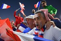 France's supporters cheer as they arrive before the Qatar 2022 World Cup Group D football match between France and Denmark at Stadium 974 in Doha on November 26, 2022. (Photo by FRANCK FIFE / AFP)