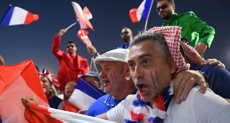 France's supporters cheer as they arrive before the Qatar 2022 World Cup Group D football match between France and Denmark at Stadium 974 in Doha on November 26, 2022. (Photo by FRANCK FIFE / AFP)