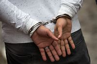 HEMMINGFORD, QUEBEC - FEBRUARY 23: A man from Turkey is handcuffed by Royal Canadian Mounted Police after he crossed the U.S.-Canada border into Canada with his family, February 23, 2017 in Hemmingford, Quebec. In the past month, hundreds of people have crossed Quebec land border crossings in attempts to seek asylum and claim refugee status in Canada.   Drew Angerer/Getty Images/AFP
== FOR NEWSPAPERS, INTERNET, TELCOS & TELEVISION USE ONLY ==
