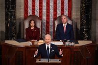 TOPSHOT - US Vice President Kamala Harris and US Speaker of the House Kevin McCarthy (R-CA) listen as US President Joe Biden delivers the State of the Union address in the House Chamber of the US Capitol in Washington, DC, on February 7, 2023. (Photo by ANDREW CABALLERO-REYNOLDS / AFP)