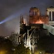 (FILES) In this file photo taken on April 15, 2019 firefighters douse flames billowing from the roof at Notre-Dame Cathedral in Paris. - One year ago, on April 15, 2019, a fire erupted in Notre-Dame Cathedral in Paris, partly destroying the nearly millenium old building and its precious artworks visited by millions of people a year. (Photo by LUDOVIC MARIN / AFP)