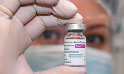 A nurse holds a vial of the Oxford-AstraZeneca vaccine against the coronavirus disease at an infectious diseases hospital in Tbilisi on March 15, 2021. (Photo by Vano SHLAMOV / AFP)