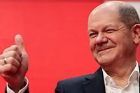 Germany's Social Democrats Party (SPD) candidate for chancellor Olaf Scholz gestures during a hybrid party conference for the approval of the traffic light coalition agreement at the party headquarters in Berlin, Germany, on December 4, 2021. (Photo by HANNIBAL HANSCHKE / POOL / AFP)