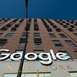 Google's name and logo on a building in New York in 2018.