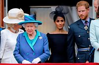 (FILES) In this file photo taken on July 10, 2018 (L-R) Britain's Camilla, Duchess of Cornwall, Britain's Queen Elizabeth II, Britain's Meghan, Duchess of Sussex, Britain's Prince Harry, Duke of Sussex, and Britain's Prince William, Duke of Cambridge come onto the balcony of Buckingham Palace to watch a military fly-past to mark the centenary of the Royal Air Force (RAF). - Britain's Prince Harry and his wife Meghan will give up their titles and stop receiving public funds following their decision to give up front-line royal duties, Buckingham Palace said on January 18, 2020. "The Sussexes will not use their HRH titles as they are no longer working members of the Royal Family," the Palace said, adding that the couple have agreed to repay some past expenses. (Photo by Tolga AKMEN / AFP)