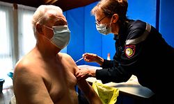 Mayor of Hoedic, Jean-Luc Chiffoleau, receives a dose of a Covid-19 (coronavirus) vaccine at the city hall of Ile d'Hoedic, western France, on January 29, 2021. (Photo by Fred TANNEAU / AFP)