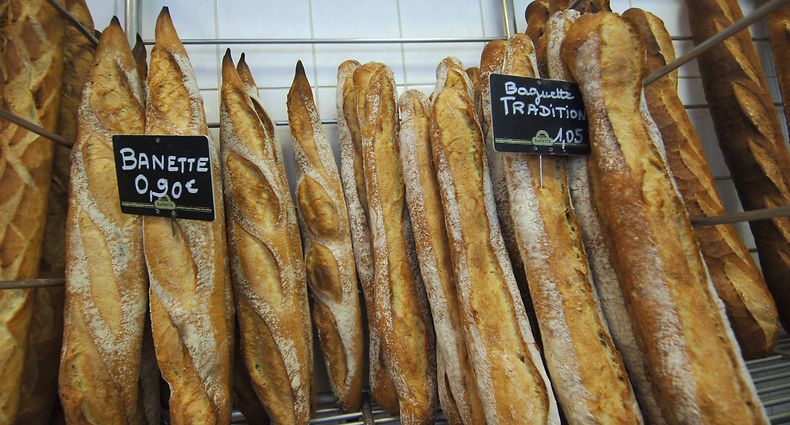 (FILES) This file photo taken on August 27, 2007, shows baguette breads on display at a bakery in Caen, western France, as bread prices in France increase due to higher wheat prices. - The French baguette was given UNESCO World Heritage status on November 29, 2022, as the UN agency granted "intangible cultural heritage status" to the tradition of making the baguette and the lifestyle that surrounds them. (Photo by MYCHELE DANIAU / AFP)