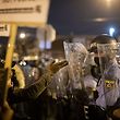 PHILADELPHIA, PA - OCTOBER 27: A demonstrator gestures at police forming a barricade line during a protest near the location where Walter Wallace, Jr. was killed by two police officers on October 27, 2020 in Philadelphia, Pennsylvania. Protests erupted after the fatal shooting of 27-year-old Wallace Jr, who Philadelphia police officers claimed was armed with a knife.   Mark Makela/Getty Images/AFP
== FOR NEWSPAPERS, INTERNET, TELCOS & TELEVISION USE ONLY ==