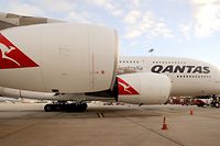 (FILES) This file picture taken on August 11, 2011 shows a Qantas A380 Airbus on the tarmac at Tullamarine Airport in Melbourne, Australia.  Qantas removed one of its Airbus A380 superjumbos from service on February 8, 2012 after discovering "minor cracks" in its wings, but said that there was no risk to flight safety.  AFP PHOTO / FILES / William WEST
