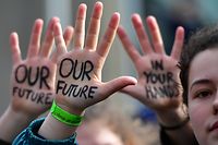 TOPSHOT - Students take part in a march for the environment and the climate o, in Brussels, on February 21, 2019. - Greta Thunberg, the 16-year-old Swedish climate activist who has inspired pupils worldwide to boycott classes, urged the European Union on February 21, 2019 to double its ambition for greenhouse gas cuts. (Photo by EMMANUEL DUNAND / AFP)