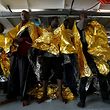 Migrants stand on the deck of Malta-based NGO Migrant Offshore Aid Station (MOAS) ship Phoenix after being rescued from a rubber dinghy in central Mediterranean on international waters some 15 nautical miles off the coast of Zawiya in Libya, April 14, 2017. REUTERS/Darrin Zammit Lupi
