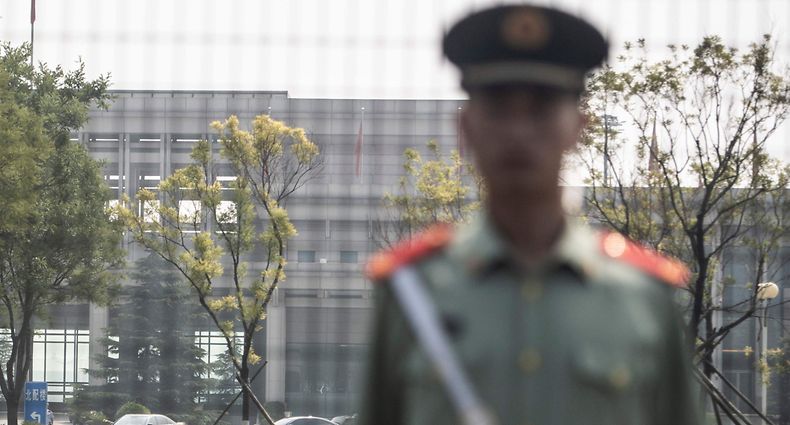 Chinese paramilitary police officer stands guard at the airport'a VIP gate, as North Korean leader Kim Jong Un visits China, in Beijing on June 19, 2018. 
The trip will be Kim's third to China since March, when he made his inaugural foreign visit as leader. / AFP PHOTO / FRED DUFOUR