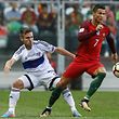 Portugal´s Cristiano Ronaldo (R) fights for the ball with Jonas Tor Naes of Faroe Islands during their FIFA 2018 World Cup qualifying soccer match at Bessa Stadium, Porto, Portugal, 31 August 2017. PAULO NOVAIS/LUSA