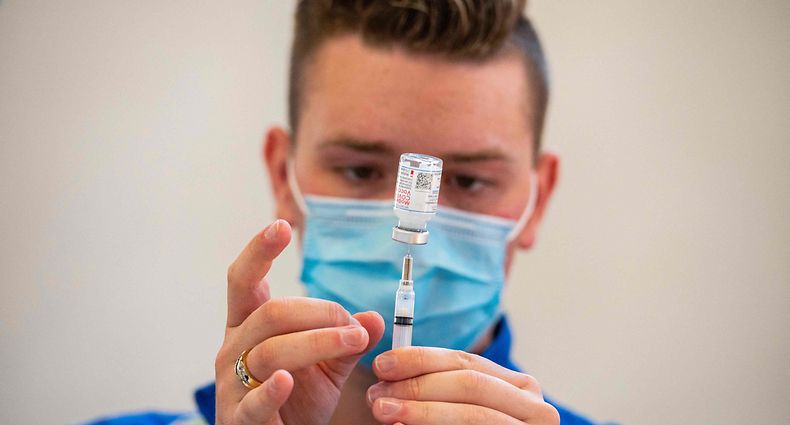 Registered nurse Frederick Morley loads syringes with the Moderna Covid-19 vaccine at a mobile Covid-19 vaccination clinic at Saint Charles Borromeo Catholic Church's McGivney community center in Bridgeport, Connecticut on April 20, 2021. - The clinic is serving the local parish community who live around the church and many whom without local access to the vaccine due to language, immigration and transportation barriers. (Photo by Joseph Prezioso / AFP)