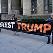 Protesters hold a banner outside the New York State Supreme Court during the hearing of Former Trump Organization Chief Financial Officer Allen Weisselberg on August 18, 2022. - Weisselberg, a long-time employee of former US President Donald Trump's company, was charged with 15 felony counts in connection with an alleged scheme stretching back to 2005 that sought "to compensate Weisselberg and other Trump Organization executives in a manner that was 'off the books.'"
Prosecutors allege Weisselberg failed to pay taxes on $1.7 million in income, including luxury perks, such as a Manhattan apartment, a pair of Mercedes-Benz cars and private school tuition for two family members. (Photo by TIMOTHY A. CLARY / AFP)