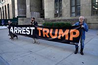 Protesters hold a banner outside the New York State Supreme Court during the hearing of Former Trump Organization Chief Financial Officer Allen Weisselberg on August 18, 2022. - Weisselberg, a long-time employee of former US President Donald Trump's company, was charged with 15 felony counts in connection with an alleged scheme stretching back to 2005 that sought "to compensate Weisselberg and other Trump Organization executives in a manner that was 'off the books.'"
Prosecutors allege Weisselberg failed to pay taxes on $1.7 million in income, including luxury perks, such as a Manhattan apartment, a pair of Mercedes-Benz cars and private school tuition for two family members. (Photo by TIMOTHY A. CLARY / AFP)
