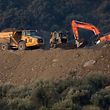 Rescue workers continue efforts to find a boy who fell down a well in Totalan in southern Spain on January 17, 2019. - Rescuers racing to save a two-year-old boy who fell down a well in southern Spain have found several strands of his hair, authorities said, raising hopes of finding the toddler whose fate has gripped the nation for days. It is the first confirmation that Julen is down the 110-metre (360-foot) deep shaft after family members said he tumbled in while playing as his parents had lunch nearby. (Photo by JORGE GUERRERO / AFP)